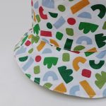 Gorro reversible collage en verde y blanco